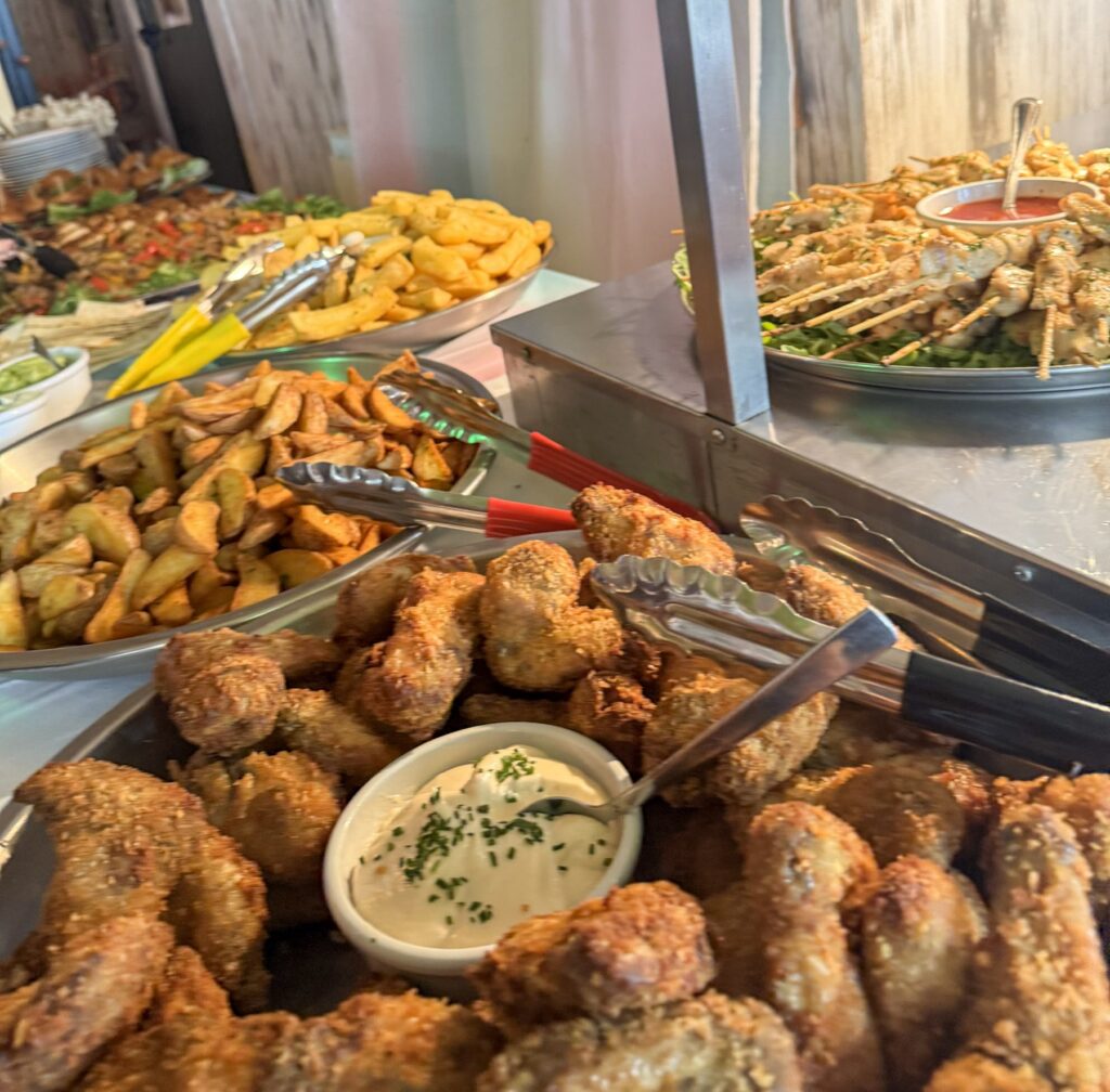 Close-up of a function buffet at Marina Metro Hotel, with fried chicken, wedges and dips